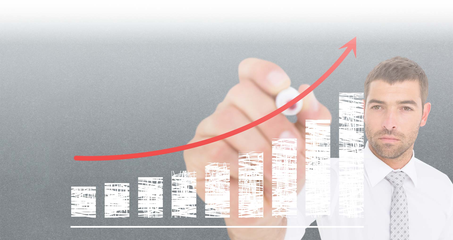 Close-up of a business professional reviewing a positive revenue growth chart, representing financial success.